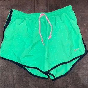 neon green nike athletic shorts with pink string